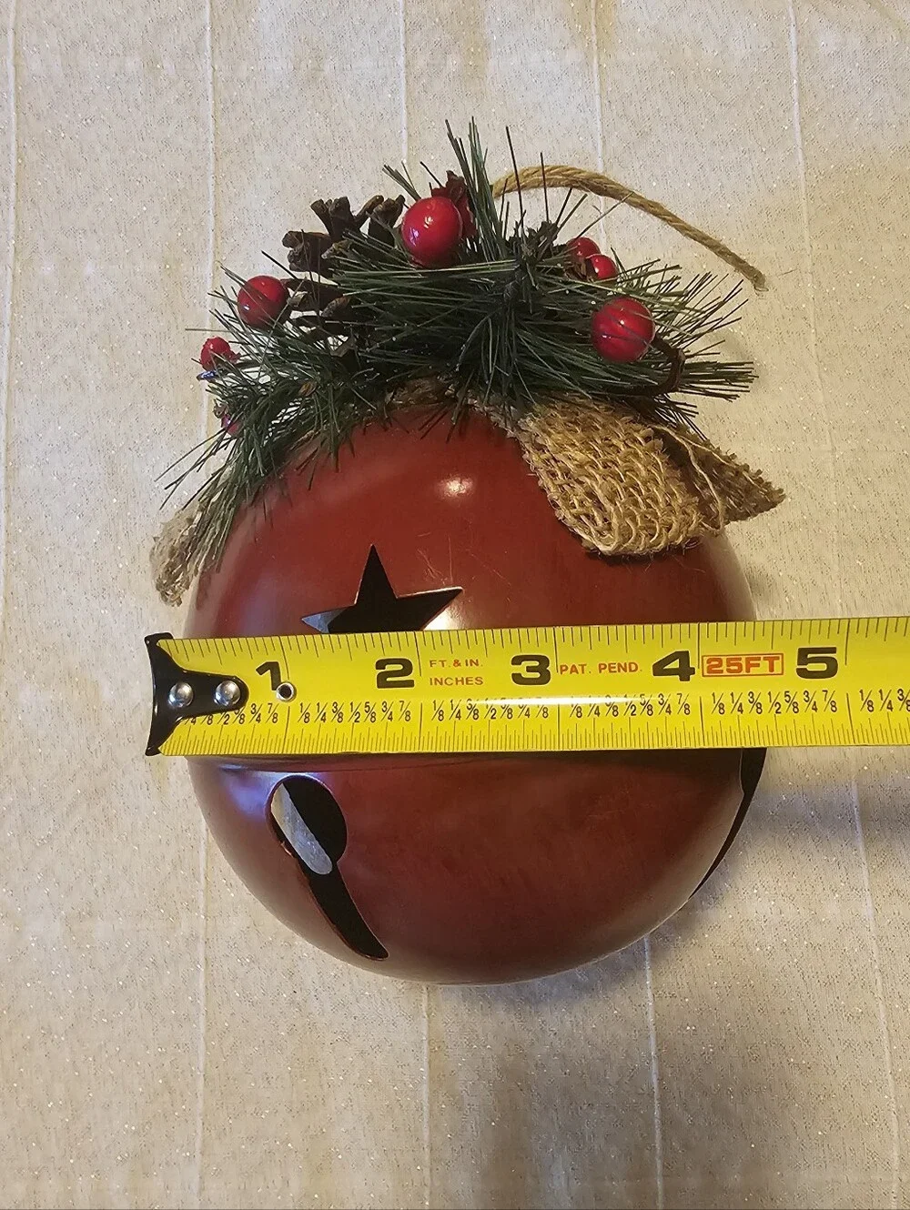 Large Rustic Red Bell Christmas Decor with Star Cutouts & Burlap Bow